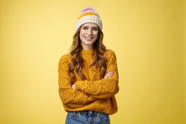 confident-relaxed-attractive-outgoing-caucasian-s-woman-wearing-hat-stylish-sweater-cross-arms-chest